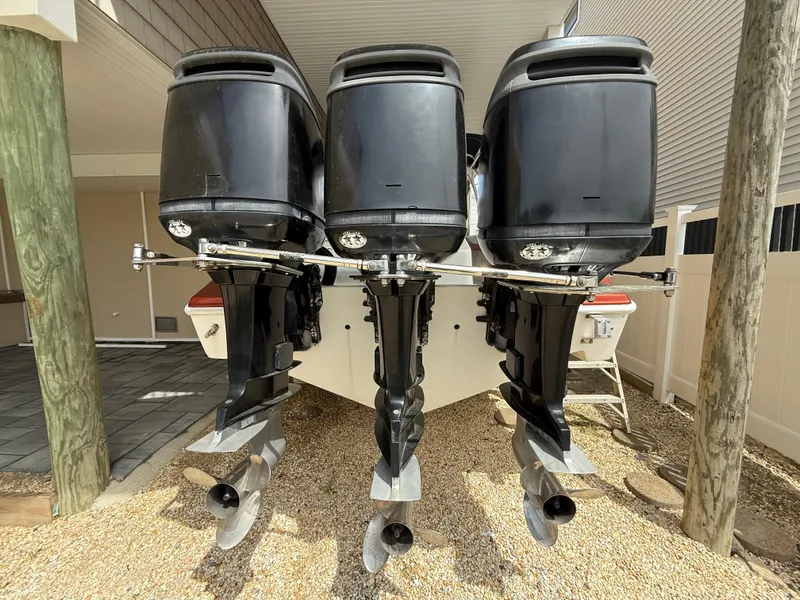 Slide: The Image of 2007 Carrera Boats 36 Center Console with triple outboard engines, rear view. - 35