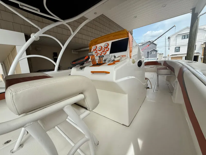 Slide: The Image of 2007 Carrera Boats 36 Center Console interior with helm and seating area. - 4