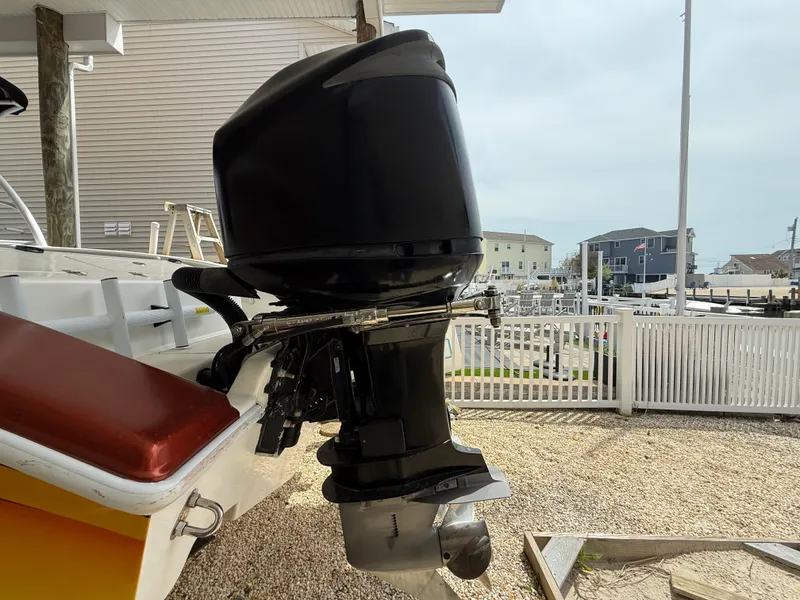 Slide: The Image of 2007 Carrera Boats 36 Center Console with powerful outboard motor, docked near waterfront homes. - 41