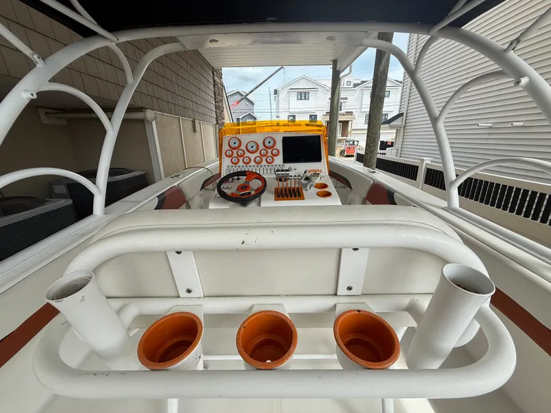 Slide: The Image of 2007 Carrera Boats 36 Center Console, helm view with controls and cup holders. - 9