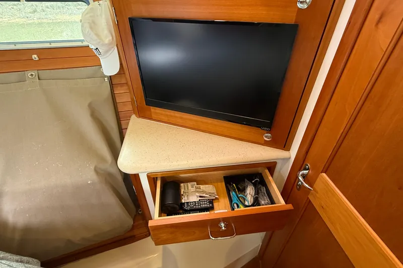 Slide: The Image of Interior of 2016 MJM 40z Downeast boat with TV and open drawer. - 53