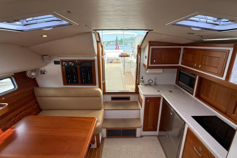 Slide: The Image of Interior of 2016 MJM 40z Downeast yacht with kitchen and seating area. - 26