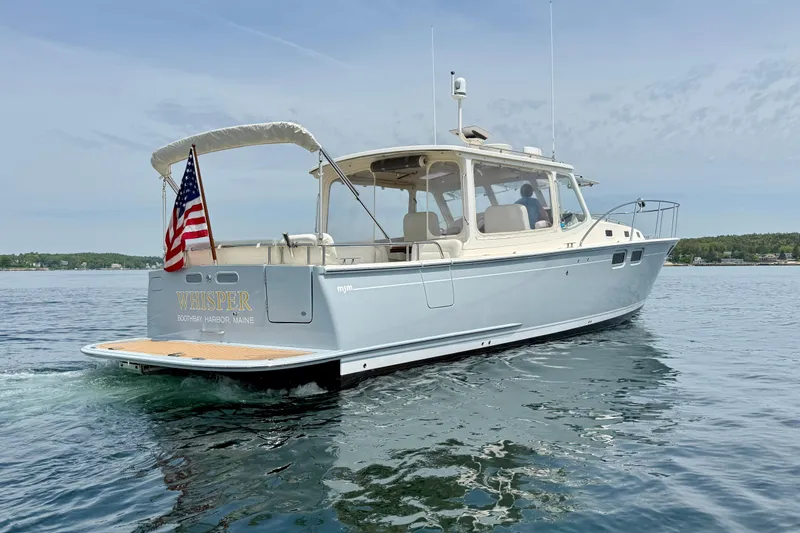 Slide: The Image of 2016 MJM 40z Downeast boat on water, American flag, Boothbay Harbor, Maine. - 3