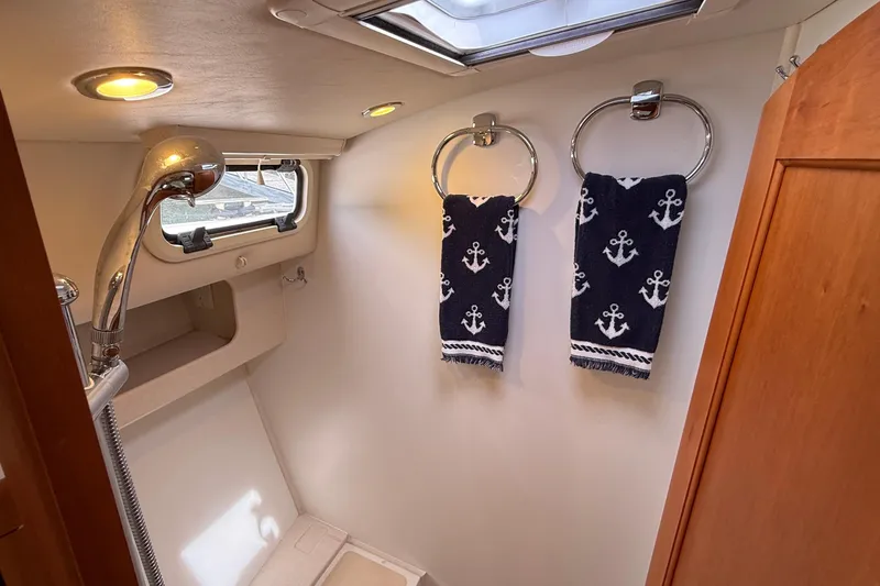 Slide: The Image of Bathroom interior of 2016 MJM 40z Downeast yacht with nautical-themed towels. - 57