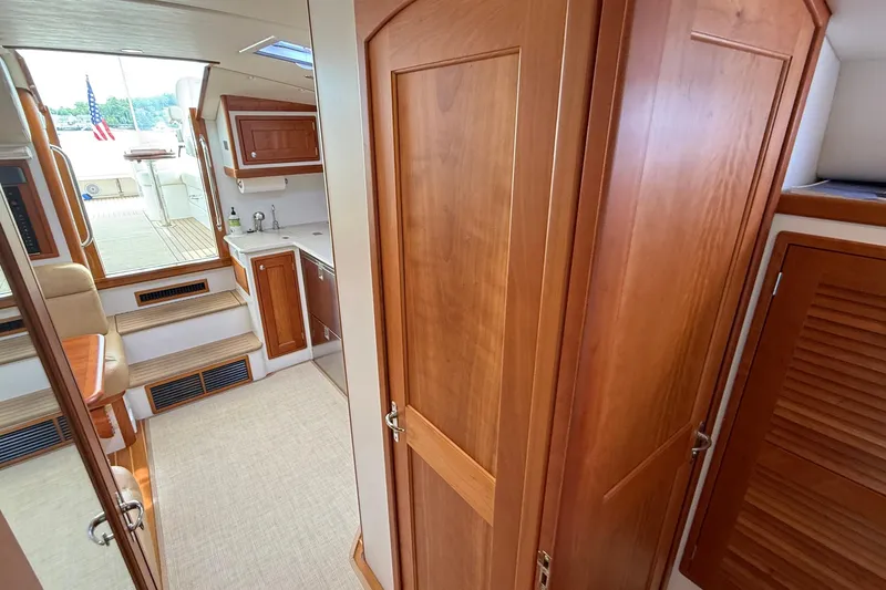 Slide: The Image of Interior of 2016 MJM 40z Downeast yacht with wooden cabinetry and seating. - 48