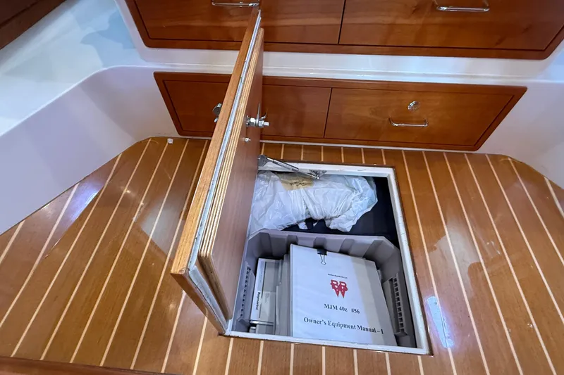 Slide: The Image of Storage compartment on 2016 MJM 40z Downeast boat with owner's manual and equipment. - 45