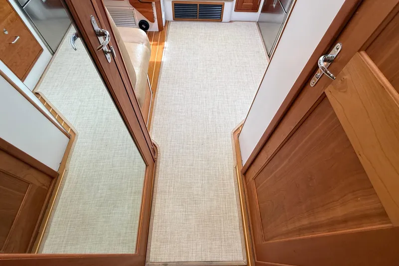 Slide: The Image of Interior view of 2016 MJM 40z Downeast yacht with wooden doors and carpeted floor. - 59