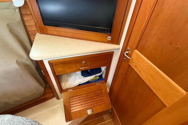 Slide: The Image of Interior of 2016 MJM 40z Downeast yacht with wooden cabinetry and storage. - 55