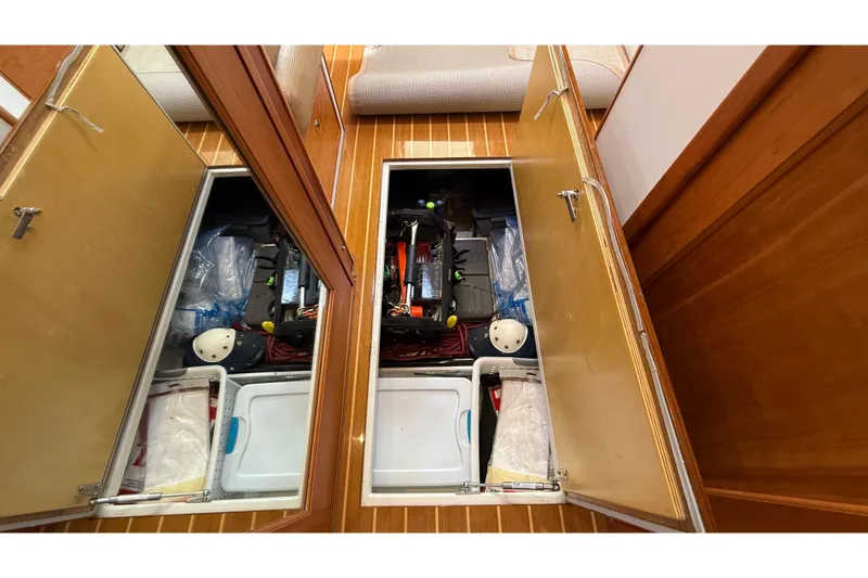 Slide: The Image of Storage compartments on 2016 MJM 40z Downeast boat, featuring organized equipment and supplies. - 60