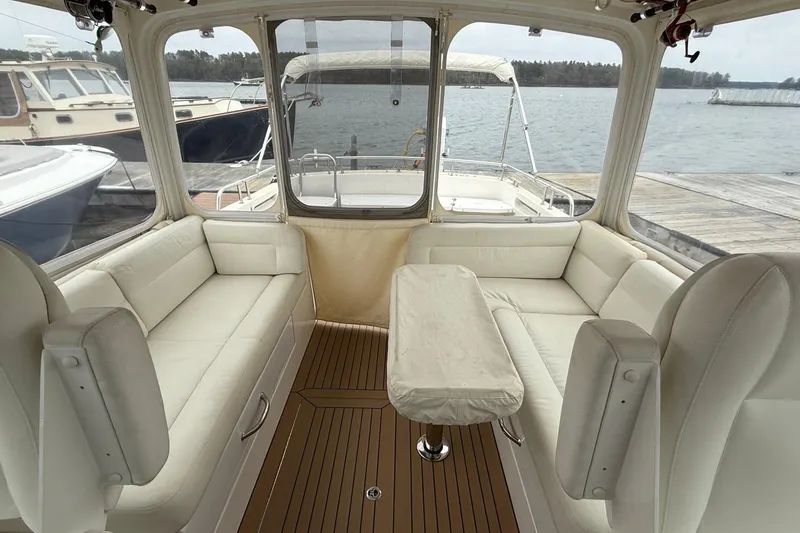 Slide: The Image of Interior of 2016 MJM 40z Downeast yacht with white seating and wooden flooring. - 15