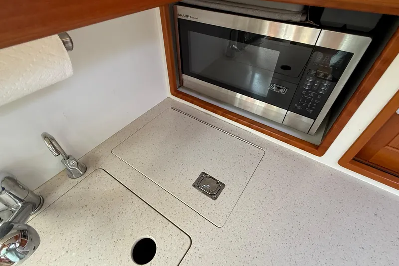 Slide: The Image of Modern galley kitchen in 2016 MJM 40z Downeast boat with microwave and sink. - 37