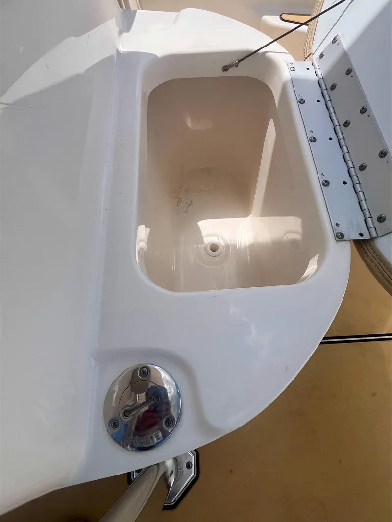 Slide: The Image of 2020 Key West 189 FS boat livewell with open lid and clean interior. - 16
