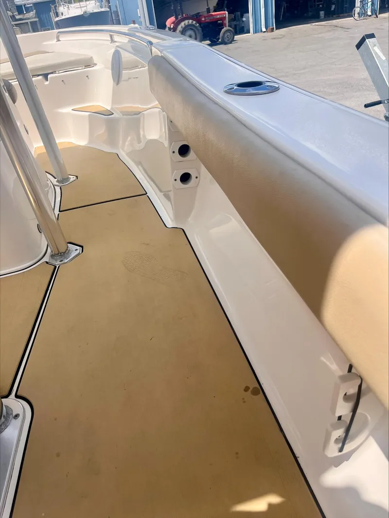 Slide: The Image of 2020 Key West 189 FS boat interior with tan seating and white deck. - 19