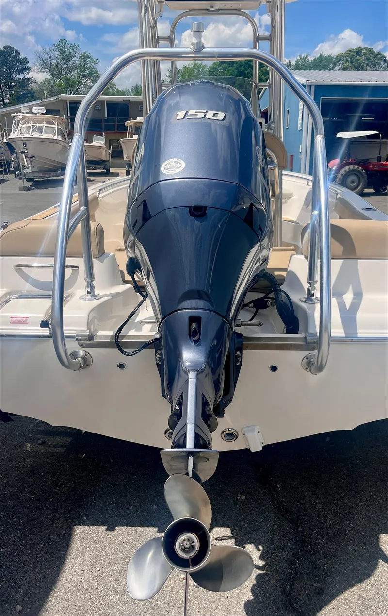 Slide: The Image of 2020 Key West 189 FS boat with powerful outboard motor, docked outdoors. - 3