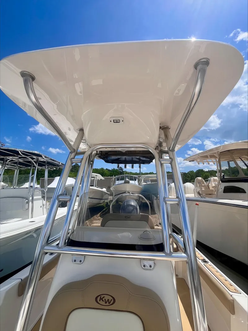 Slide: The Image of 2020 Key West 189 FS boat with T-top under a clear blue sky. - 6
