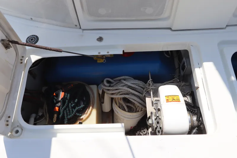Slide: The Image of Storage compartment of a 2001 Lagoon 380 catamaran with ropes and equipment. - 10