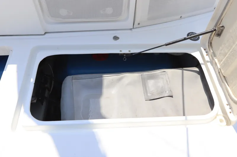Slide: The Image of Open storage compartment on a 2001 Lagoon 380 catamaran deck. - 11
