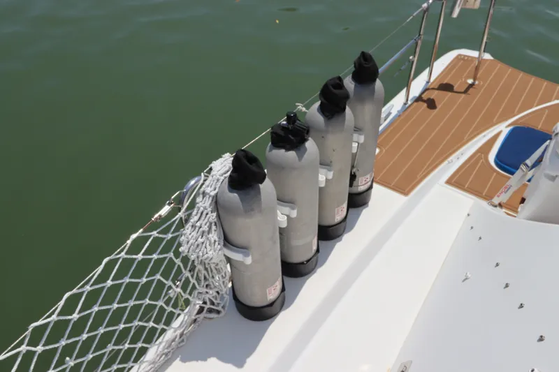 Slide: The Image of Four scuba tanks on a 2001 Lagoon 380 catamaran deck. - 17