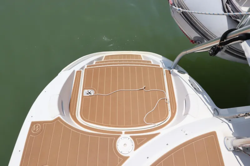 Slide: The Image of Lagoon 380 catamaran deck, 2001 model, with teak flooring and water access ladder. - 19