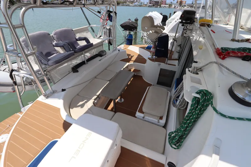 Slide: The Image of Lagoon 380 catamaran deck, 2001 model, featuring seating and nautical equipment. - 23