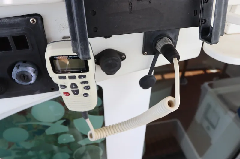 Slide: The Image of VHF radio on a 2001 Lagoon 380 catamaran control panel. - 30