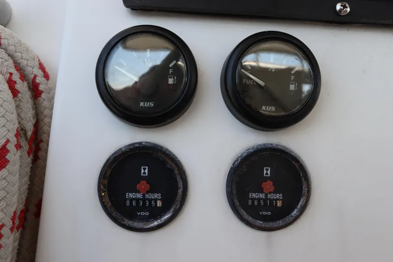 Slide: The Image of Fuel and engine hour gauges on a 2001 Lagoon 380 catamaran. - 33