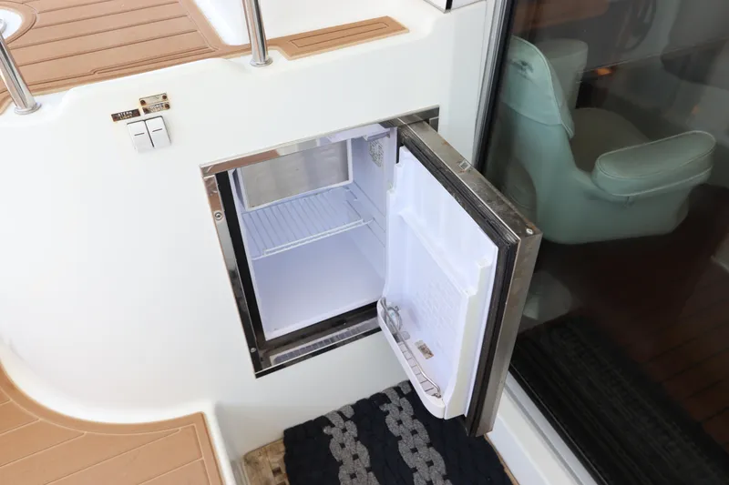 Slide: The Image of Open mini fridge on Lagoon 380 yacht, 2001 model, with wooden deck and glass door. - 36