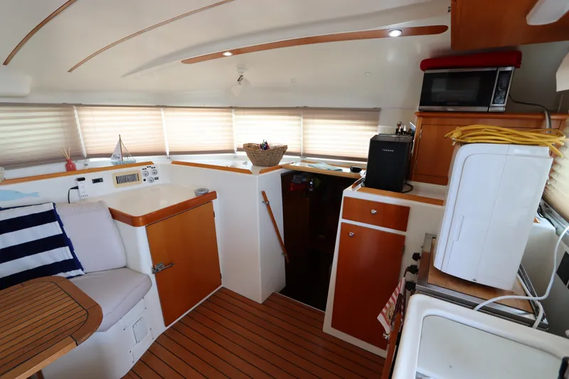 Slide: The Image of Interior of 2001 Lagoon 380 catamaran with wood accents and modern amenities. - 46