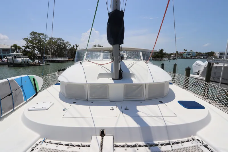 Slide: The Image of Lagoon 380 catamaran, 2001 model, docked with visible deck and rigging. - 9