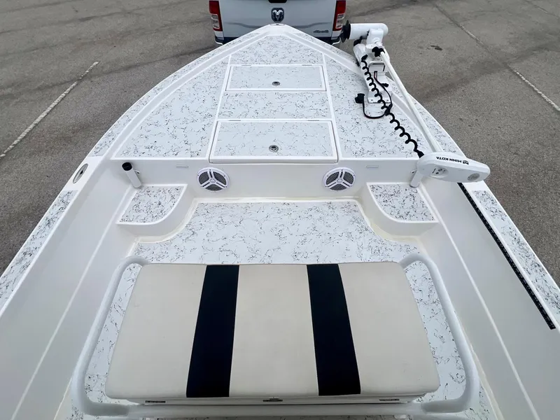 Slide: The Image of 2015 Shallow Sport 24 Modified V boat deck with seating and storage compartments. - 13