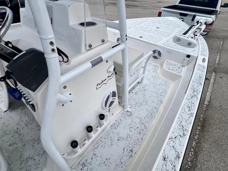 Slide: The Image of 2015 Shallow Sport 24 Modified V boat interior with console and speakers. - 14