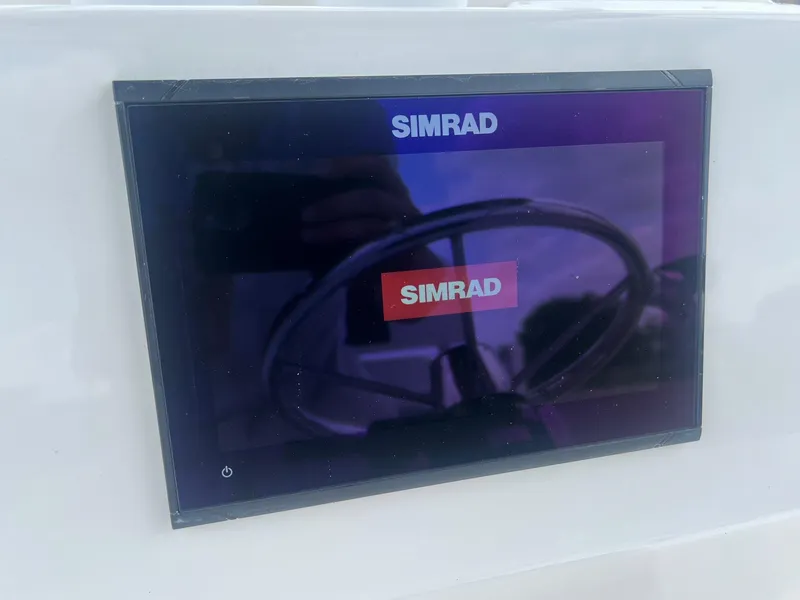 Slide: The Image of Simrad display on 2015 Shallow Sport 24 Modified V boat dashboard. - 16