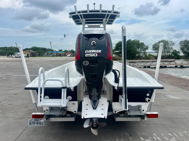 Slide: The Image of 2015 Shallow Sport 24 Modified V boat with Evinrude 250 engine at dock. - 3