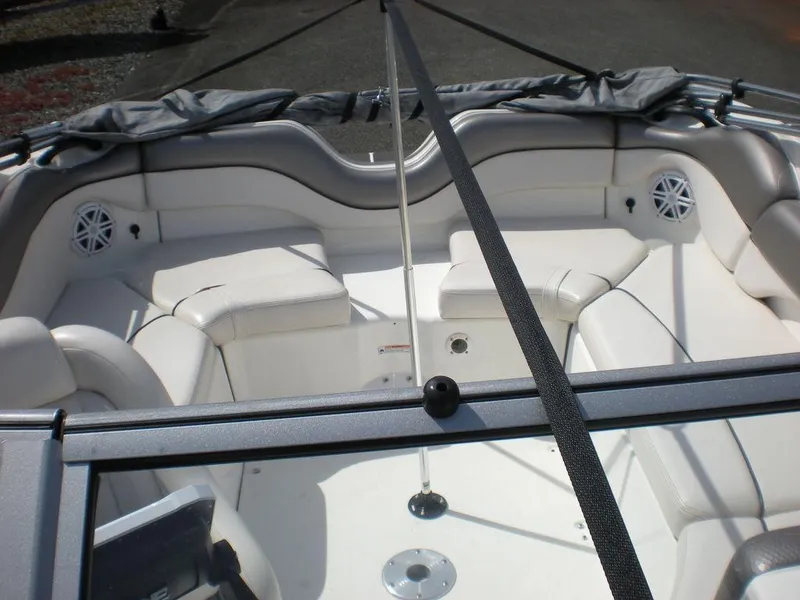 Slide: The Image of 2011 Yamaha AR210 boat interior with white seating and speakers. - 4