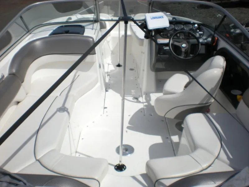 Slide: The Image of 2011 Yamaha AR210 boat interior with seating and steering console. - 8