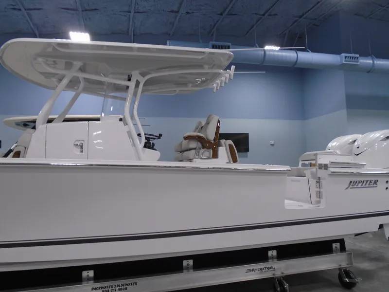 Slide: The Image of 2025 Jupiter 32 boat in showroom, featuring sleek design and modern amenities. - 10