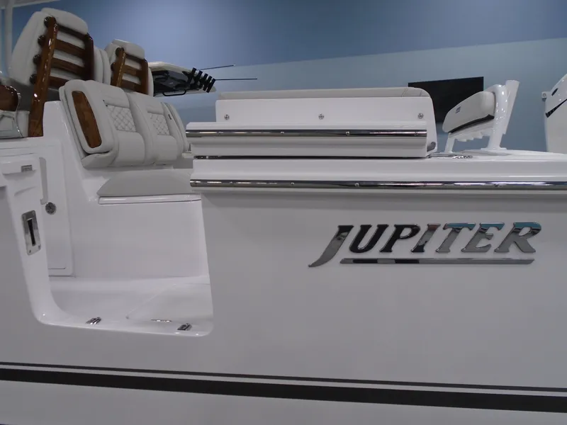 Slide: The Image of 2025 Jupiter 32 boat interior with cushioned seating and sleek design. - 13