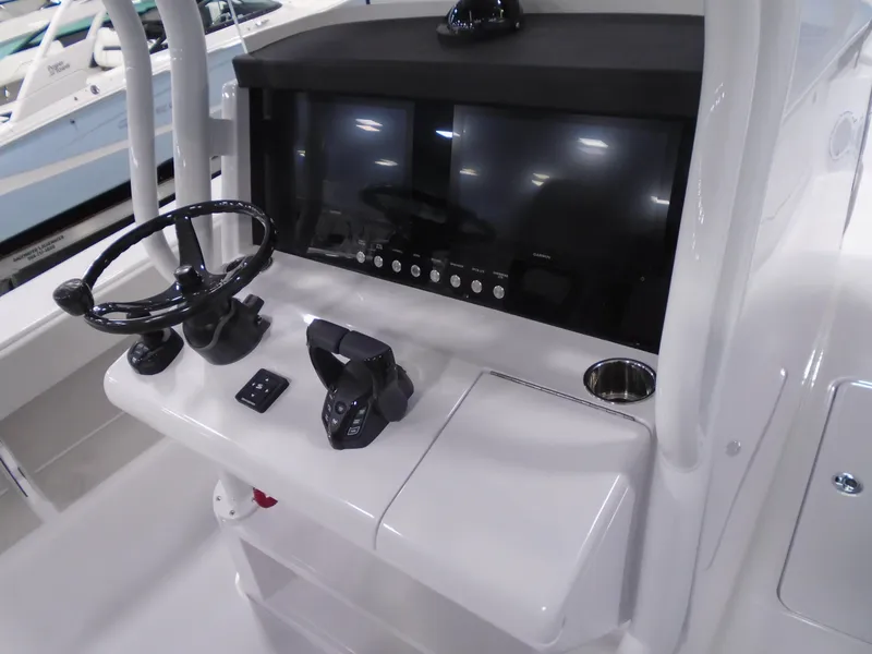 Slide: The Image of 2025 Jupiter 32 boat console with steering wheel, controls, and display screens. - 20