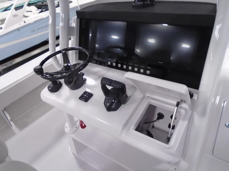 Slide: The Image of 2025 Jupiter 32 boat console with steering wheel and controls. - 21