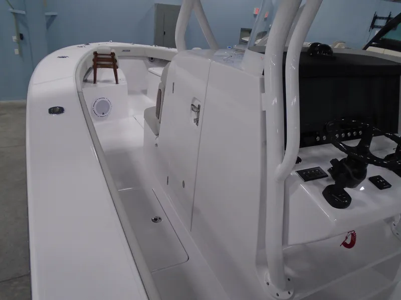 Slide: The Image of 2025 Jupiter 32 boat interior with modern console and seating. - 24