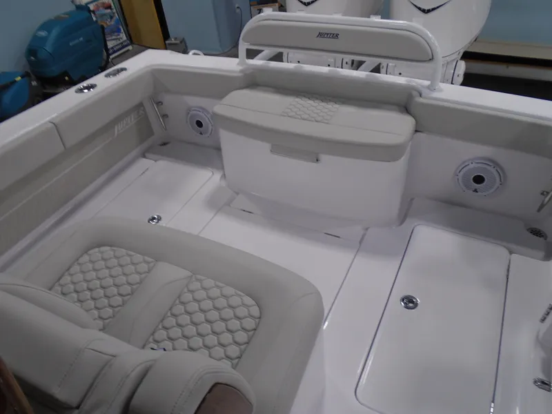 Slide: The Image of 2025 Jupiter 32 boat interior with cushioned seating and modern design. - 25