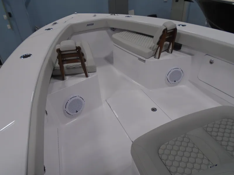 Slide: The Image of 2025 Jupiter 32 boat interior with seating and speakers. - 27