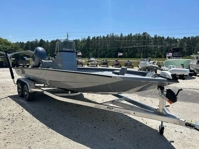 Slide: The Image of 2025 Xpress H210B boat on trailer, parked outdoors under clear blue sky. - 3
