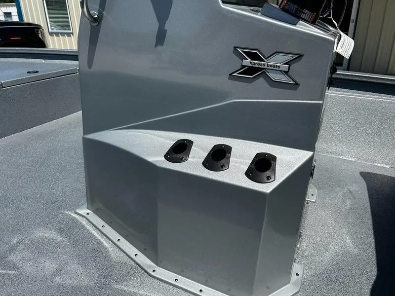 Slide: The Image of 2025 Xpress H210B boat console with rod holders and logo. - 8