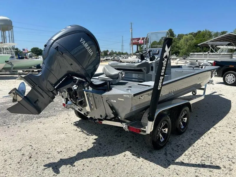 Slide: The Image of 2025 Xpress H210B boat with Yamaha engine on a trailer in a sunny outdoor setting. - 9