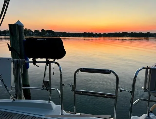 Slide: The Image of Jeanneau 58 yacht at sunset, tranquil waters, 2016 model. - 28