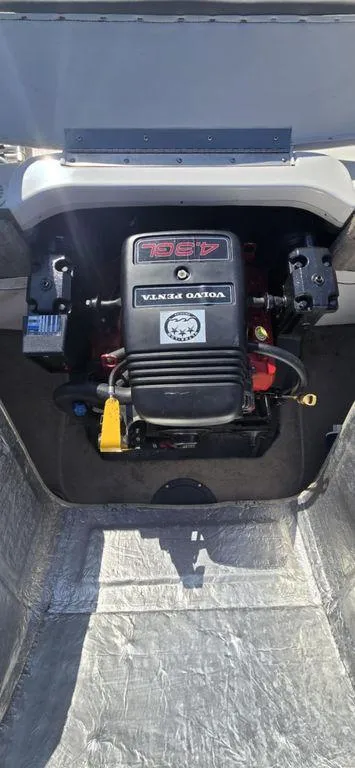 Slide: The Image of 2003 Reinell 185 boat engine compartment with Volvo Penta motor. - 1