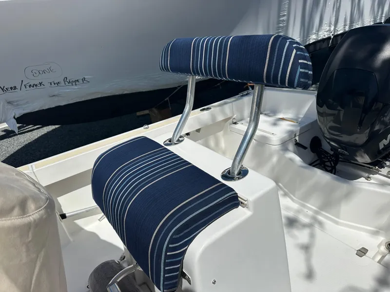 Slide: The Image of Blue-striped seating on a 2007 Holby Pilot 20 boat, featuring a sleek design. - 5