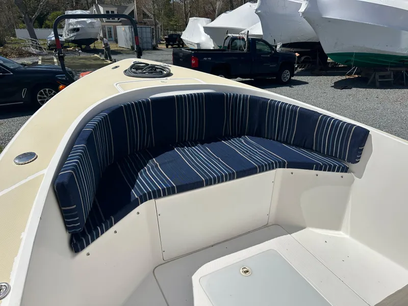 Slide: The Image of Holby Pilot 20 boat, 2007 model, featuring striped seating in the bow area. - 7