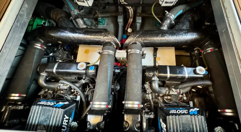 Slide: The Image of Engine compartment of a 2000 Sea Ray 310 Sundancer with twin Mercury 350 engines. - 37